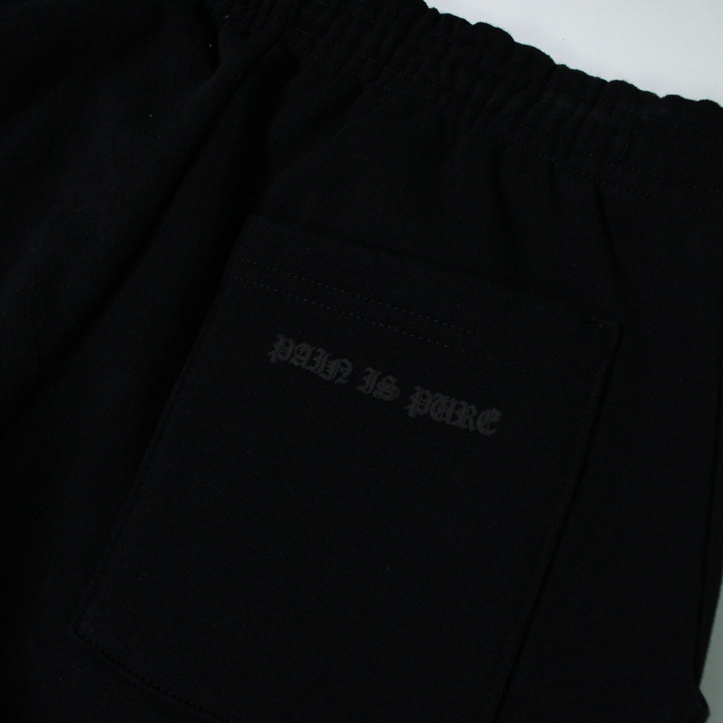 PAIN IS PURE 'PURE' SIDE LOGO SKULL SWEATPANTS BLACK/BLACK